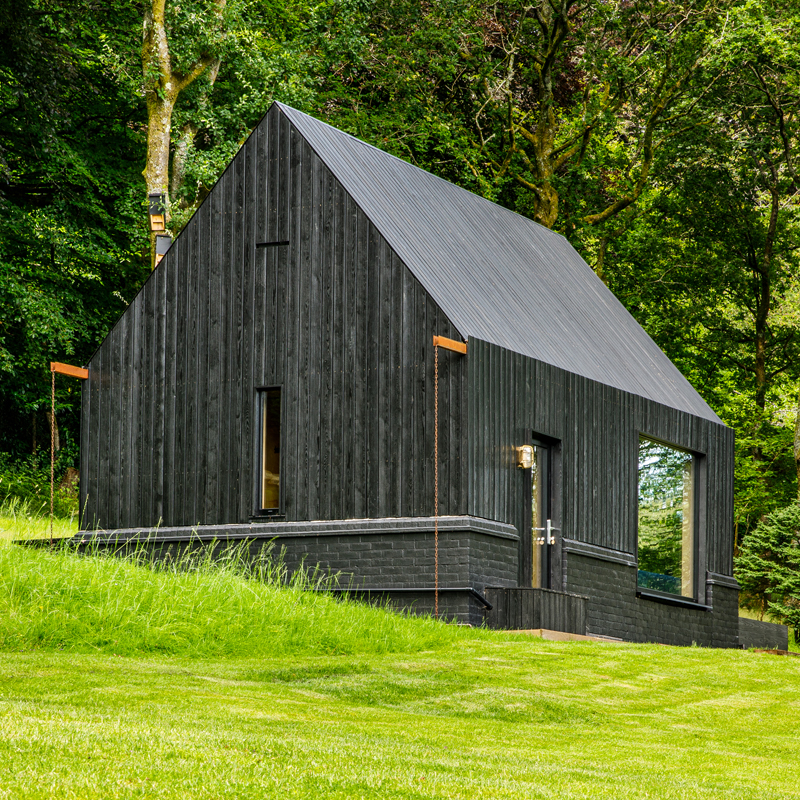 Garden cabin built from black coated larch