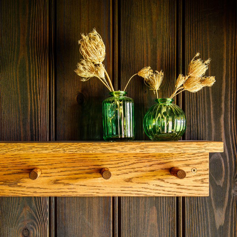 Internal timber clad wall and shelf with coat pegs