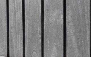 Accoya Color Grey shown in timber cladding and decking boards.