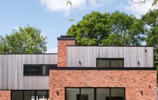 Millworks Farnham House project with weathered Western Red Cedar timber cladding.