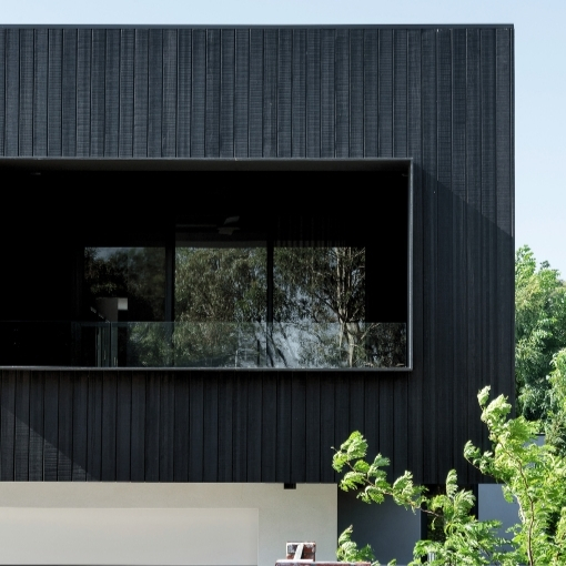 Charcoal black, Abodo Vulcan timber cladding shown on a contemporary new build.