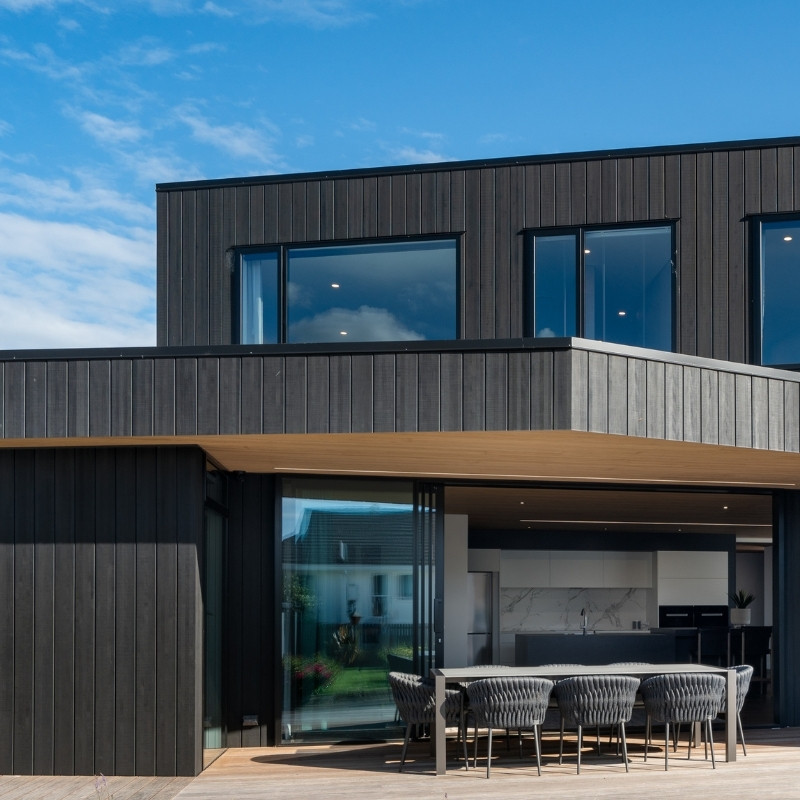 A modern project with an extended single storey, shown with Abodo Vulcan timber cladding in Charcoal Black.