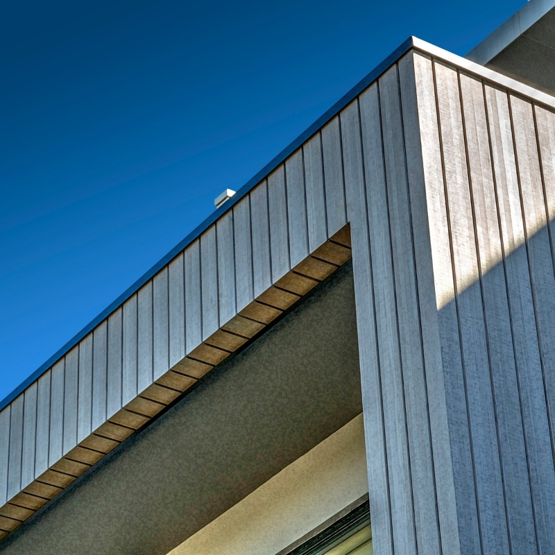 Close up of Abodo Vulcan vertical grain timber cladding in a Silver Grey finish.