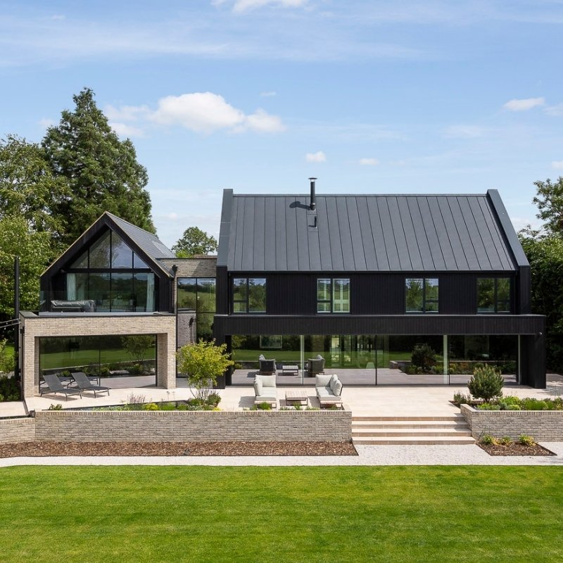 Modern Farmstead inspired home with black timber cladding.