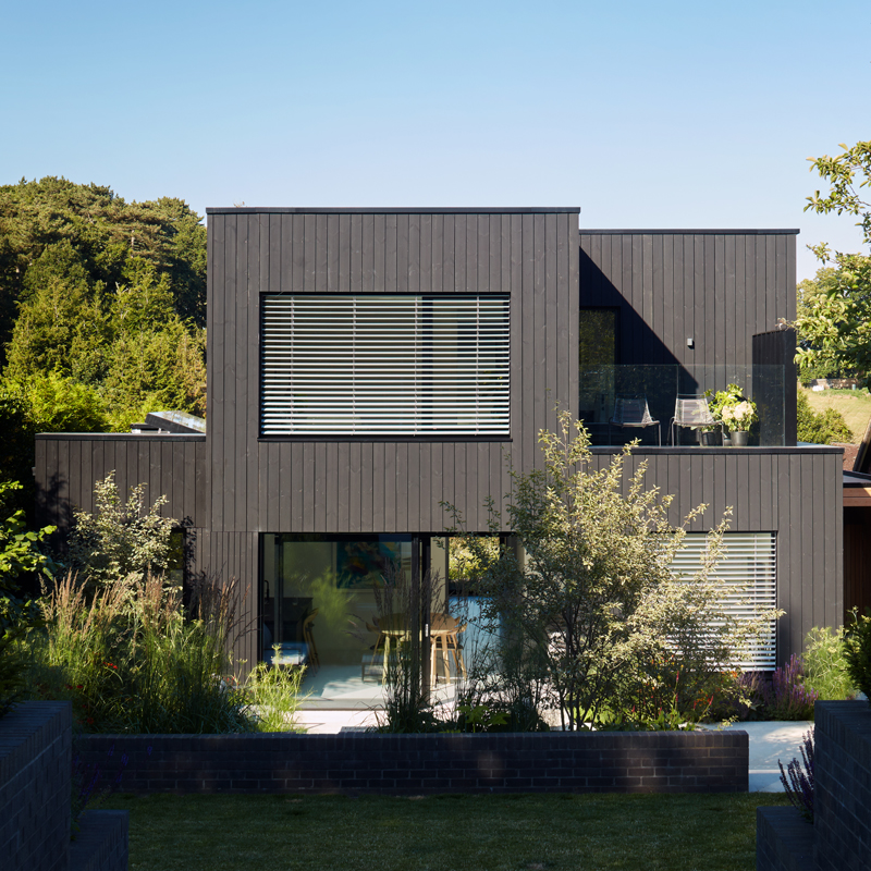 MillworksLtd-Blackwood-ThemoWood-Pine-External-Cladding Blackwood house exterior in Black ThermoWood® Pine cladding.